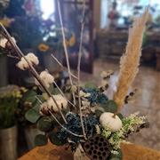 Arrangement in white ceramic pot